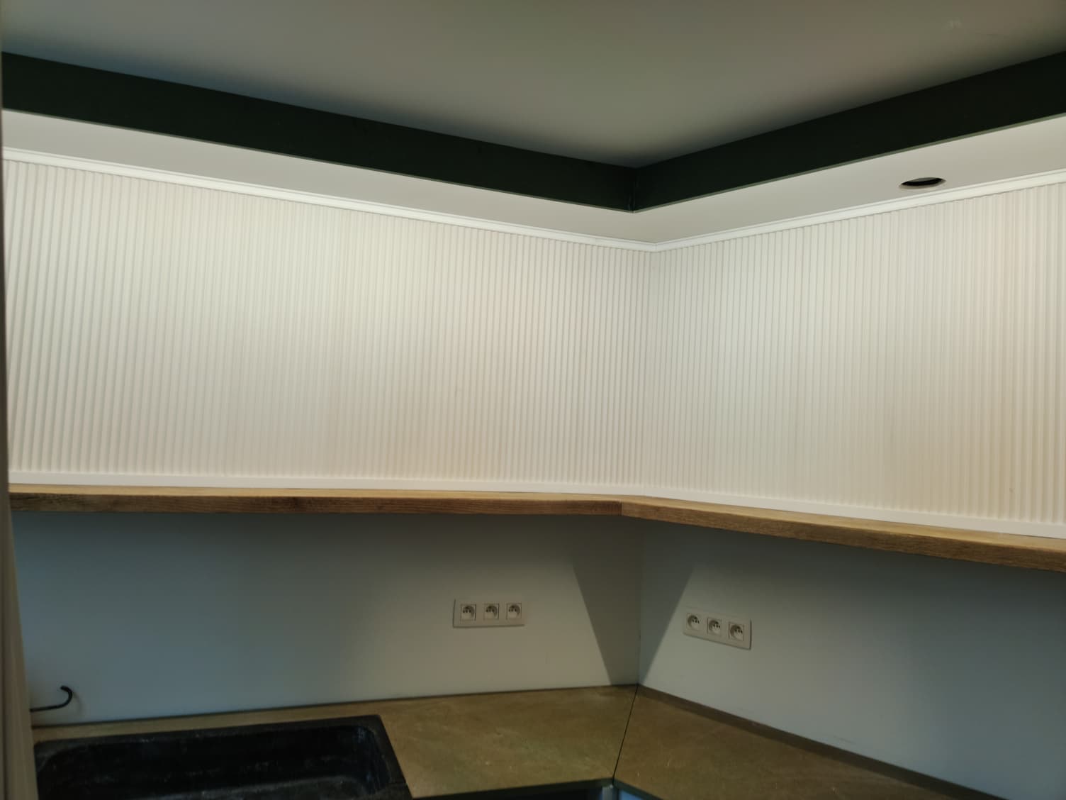 Indirect LED strip lighting installed in a modern kitchen ceiling